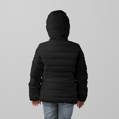 Template black winter kids puffer jacket on girl, warm clothing for cold weather, back view, presentation for design, branding. © olegphotor