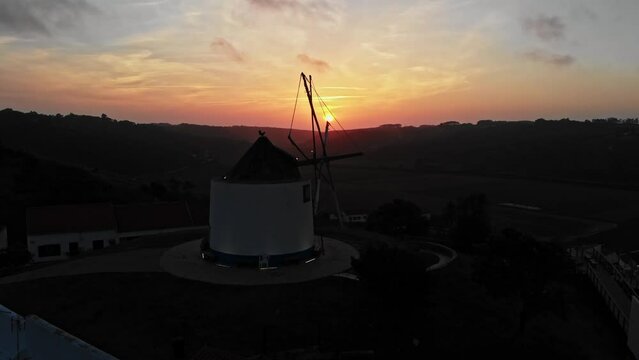 Beatiful aerial view with sunset in Portugal with old windmill and mountains