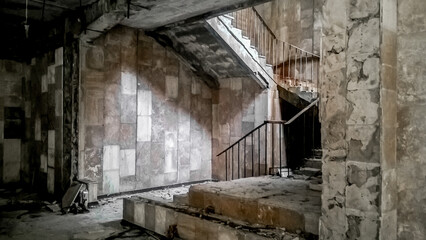 stone steps of a staircase inside an abandoned building in Chernobyl Ukraine
