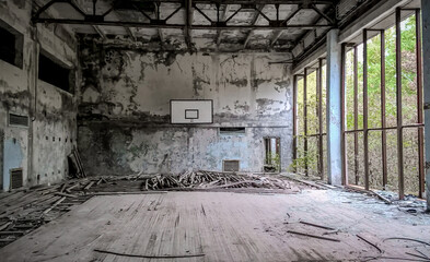 Fototapeta na wymiar ruined gymnasium in an abandoned school in Chernobyl
