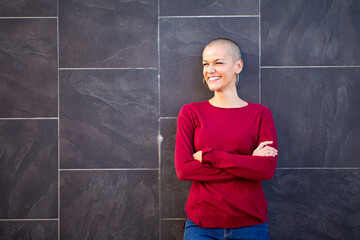 one woman smiling with shaved head