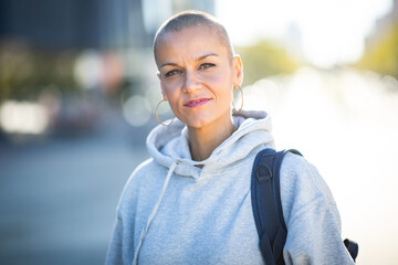 Close up woman with shaved head