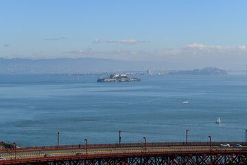 part of golden gate bridge with alcatraz in the background - 723826238