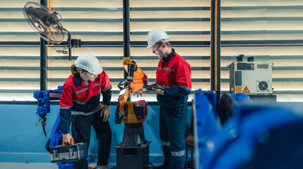 Robotic Technicians Inspecting and Repairing Factory Robot.