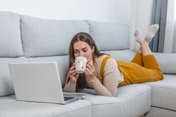Woman Resting on Couch With Laptop and Coffee