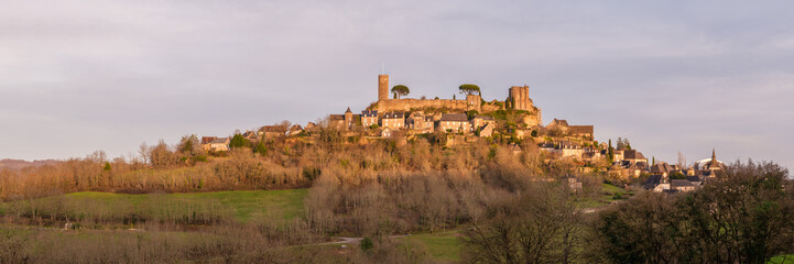 Fototapeta na wymiar Panoramic view of evening sun on the medieval castle and town of Turenne in the Correze region of Nouvelle Aquitaine in France