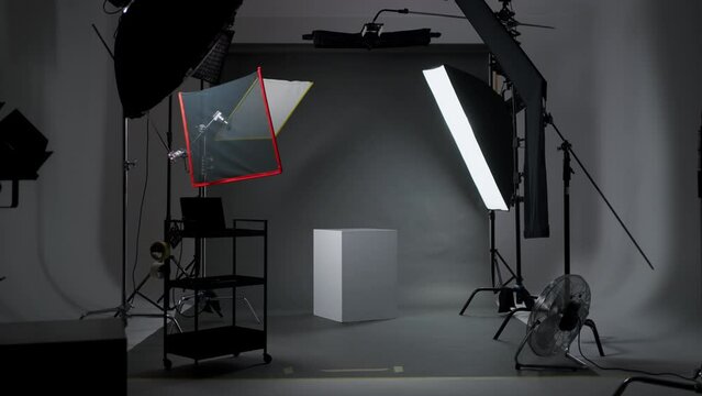 Interior of modern photo studio with octaboxes and professional photo camera on tripod