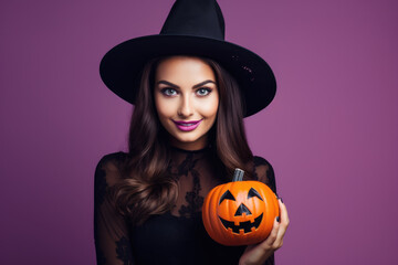 Pretty young girl in black dress and witch hat with halloween theme
