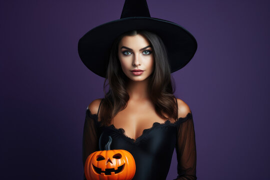 Pretty young girl in black dress and witch hat with halloween theme
