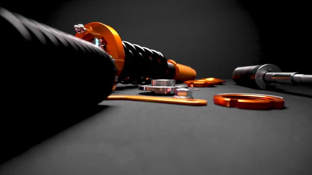 suspension tuning, coilovers, shock absorbers and front springs in yellow and gold colors for a sports drift car on a dark background