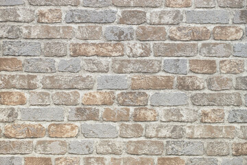 pattern of decorative stone wall background. Close-up modern beige stone tile texture brick wall