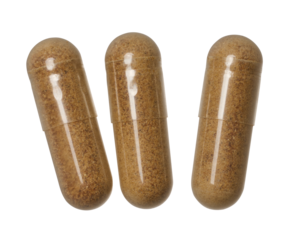 Transparent capsule with brown powder on isolated background, medical drug. Top view
