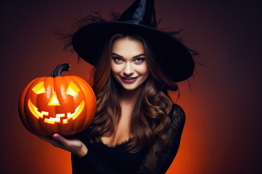 Smiling british woman in witch hat holding jack o lantern, dark red background