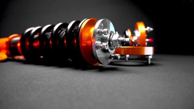 suspension tuning, coilovers, shock absorbers and front springs in yellow and gold colors for a sports drift car on a dark background