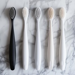 Set of black and white toothbrushes isolated on marble texture background
