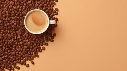 Coffee cup and coffee beans on orange background. Top view with copy space