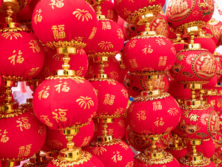 Red lanterns are hung by people during the Spring Festival