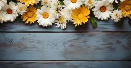 Poster flowers on wooden background. daisies on wooden background top view. daisy flowers isolated on blue wooden background for spring time Mother's Day. White and yellow daisy flower background. floral fra © Divid
