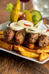 cevapcici with french fries - 723872079