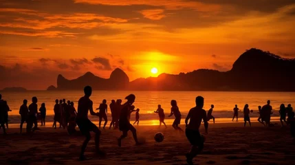 Fototapete Copacabana, Rio de Janeiro, Brasilien Silhouettes of many people playing beach soccer on the seashore at sunset. Summer vacation, holiday, summer sport, active lifestyle.