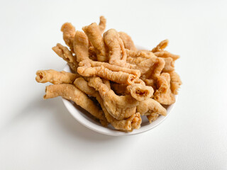 Crispy fried chicken intestines, isolated on white background