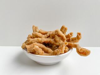 Crispy fried chicken intestines, isolated on white background