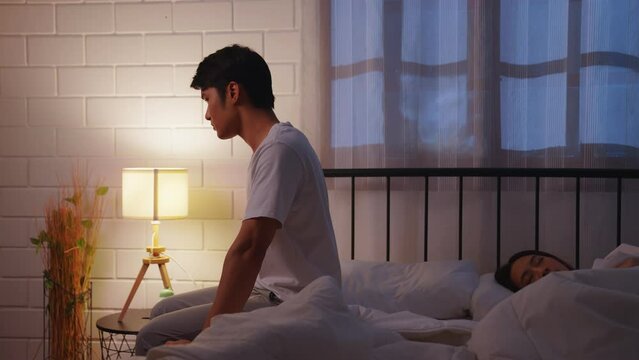 Asian young couple on bed. depression and erectile dysfunction. Man and woman with stress, sex problems or anxiety in relationship difficulties. Marriage and divorce problem concept