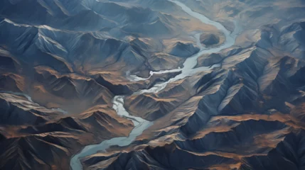 Fotobehang aerial view of a river in the middle of a rocky area. © AdamDiezel