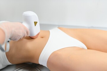 laser hair removal. Woman on laser hair removal treatments thighs and bikini area