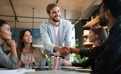 Meeting, partnership and business people shaking hands in the office for a deal, collaboration or onboarding