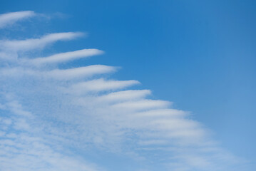 Blue sky with windy clouds