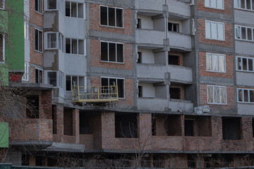 Fototapeta na wymiar Kyiv, Ukraine - January 29, 2024: There are three unfinished houses on Borshchagivka Street. construction began in 2004. high-rise buildings are abandoned. many apartments are sold out, many apartment