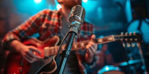 A Talented Artist Serenades The Crowd With A Vintage Microphone And Guitar. Сoncept Live Music Performance, Vintage Microphone, Guitar, Talented Artist, Crowd Serenade - obrazy, fototapety, plakaty