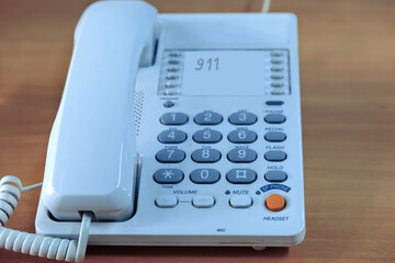 White push-button retro telephone from the 1990s.