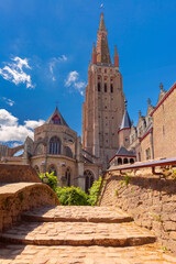 Fototapeta premium Scenic cityscape with a medieval fairytale Church of Our Lady in Bruges, Belgium