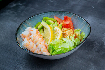 Delicious salad with salmon and juicy vegetables