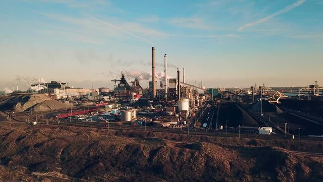 Industrial Impression: Aerial View of Steel Factory in the Netherlands with polluted Smoke