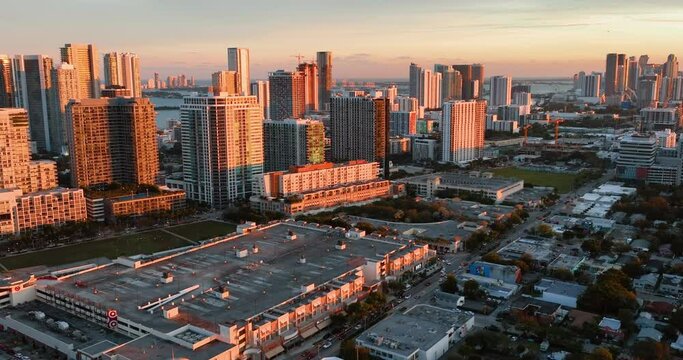 Aerial photo of downtown Miami Florida USA. Evening city in orange rays of sunset. Aerial view.