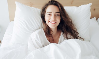 A woman laying in bed with her eyes closed