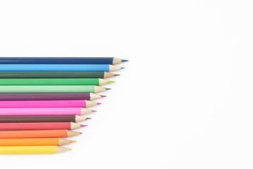 Fototapeta premium Seamless wooden coloured pencils in a row and arranged in a diagonal line, isolated on white background, copy space