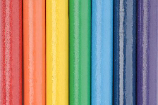 Colours of rainbow. Wooden pencils texture. Colourful background.