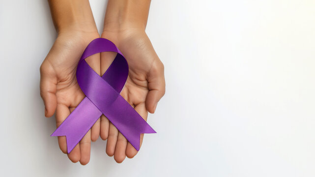 Two hands holding purple awareness ribbon, white background, top view, copy space on the right