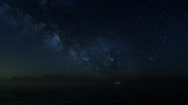 3D illustration. UFO over the sea and waves on a starry night with mountains on the horizon.