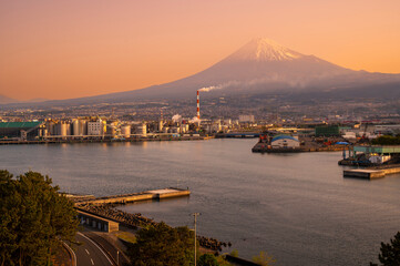 Japan industrial factory area with Fuji mountain and sun rise or sunset sky background view from...