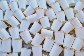 White paper cups scattered on the floor