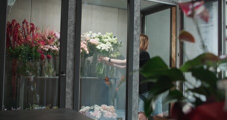 Florist works in flower store