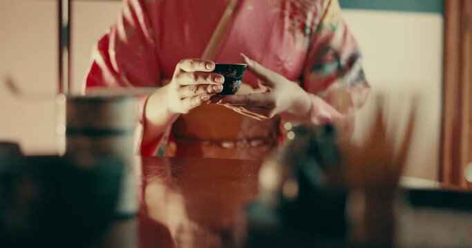 Culture, traditional and hands of Japanese woman with tea with recipe, leaves and indigenous herbs. Home, ceremony and person with herbal beverage for relax, wellness and detox for drinking ritual