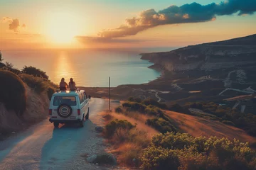  Couple of friends enjoying scenic Mediterranean view from a road side parked minivan. Travelling in camper van. Planning a road trip adventure. © MNStudio