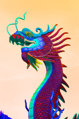 Dragon statue in colorful with peach colour background