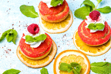 Shu cake. Custard dessert with creamy white cream, decorated with raspberries.